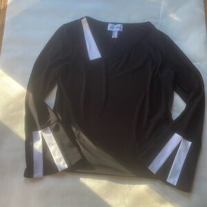 JOSEPH RIBKOFF trumpet sleeve black top. Assemetrical neckline.